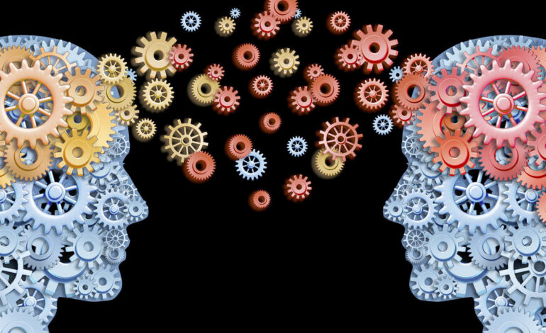 Psykologin representeras av två människohuvuden gjorda av kugghjul.
